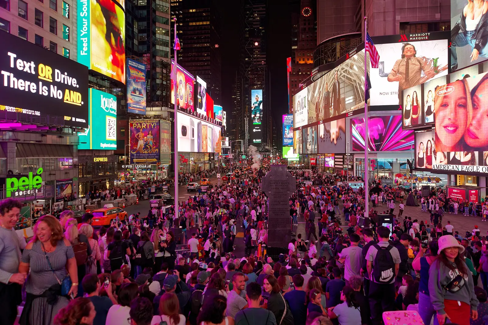 Times Square at night with billboards lit up