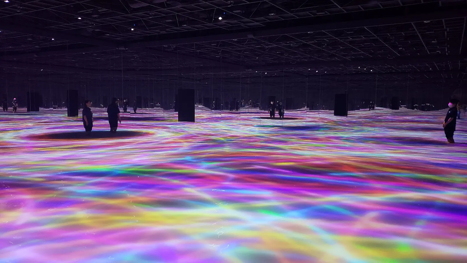 Light projections on the floor inside teamLab Planets